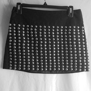 Silver studded black mini skirt